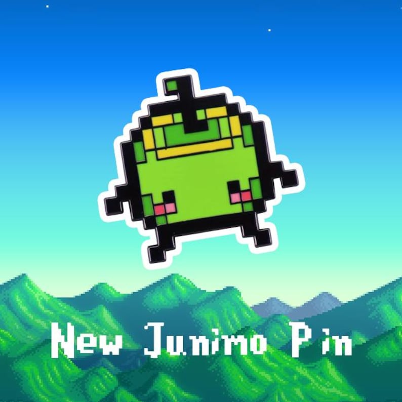 May include: A green pixelated Junimo character with a yellow headband and pink cheeks. The Junimo is against a blue sky with white stars. The text "New Junimo Pin" is at the bottom of the image.