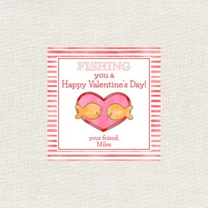 May include: A Valentine's Day card with a pink heart containing two cartoon goldfish. The card has red striped borders and text that reads "Fishing you a Happy Valentine's Day!" and "your friend, Miles."