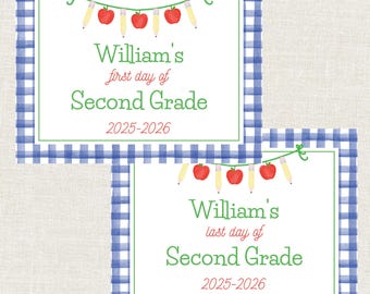 May include: Two rectangular signs with a blue and white gingham border. The top sign reads "William's first day of Second Grade 2025-2026" with apple and pencil illustrations. The bottom sign reads "William's last day of Second Grade 2025-2026".