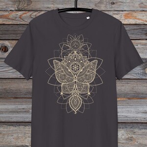 May include: A dark gray t-shirt with a gold mandala design featuring a butterfly and geometric patterns.