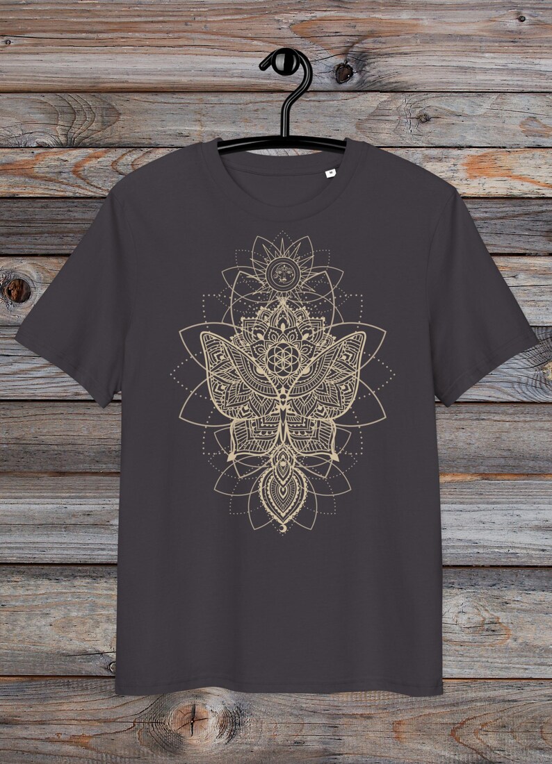 May include: A dark gray t-shirt with a gold mandala design featuring a butterfly and geometric patterns.