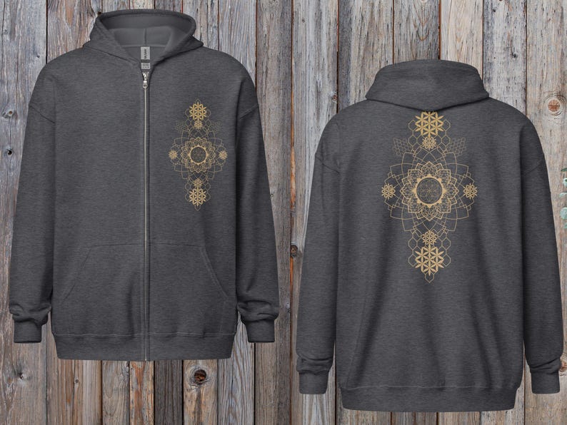 May include: Charcoal gray zip-up hoodie with a gold geometric mandala design on the front and back. The hoodie has a hood, a full-length zipper, and two front pockets. The design features intricate patterns.