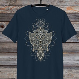 May include: A navy blue t-shirt with a gold mandala design featuring a butterfly and geometric patterns.