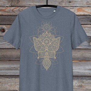 May include: A heather grey t-shirt with a gold mandala design featuring a butterfly and geometric patterns.