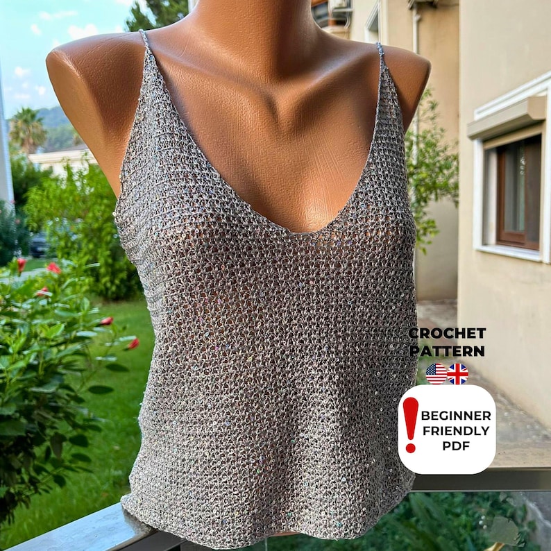 Detailed front view of sparkly grey crochet tank top with V-stitch mesh design and plunging neckline, made from beginner-friendly PDF crochet pattern for festival wear.