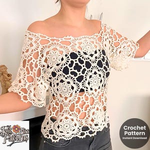 Puede incluir: Un top de crochet blanco con un diseño de hombros descubiertos y un patrón floral. El top está hecho de una tela ligera y aireada y tiene un ajuste holgado. Patrón de crochet Descarga instantánea.