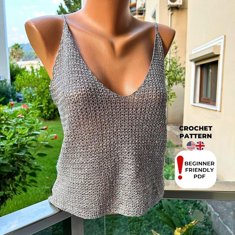 Woman wearing grey sequin crochet blouse with V-neck design and mesh texture, handmade from digital PDF pattern for coastal grandmother summer style and boho festival fashion.