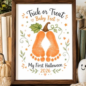 May include: A framed print featuring the text Trick or Treat Baby Feet My First Halloween 2026. The design includes a watercolor illustration of two orange baby footprints shaped like a pumpkin with a green leaf and stem, surrounded by small orange hearts and stars.