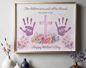 May include: A framed print with a gold border features a watercolor design for Mother's Day. The artwork includes handprints, a cross, floral arrangements, and hearts. The text reads "Her children arise and call her blessed" and "Happy Mother's Day."