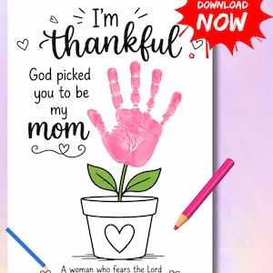 May include: Printable art print with the text "I'm thankful" and "God picked you to be my mom." A pink handprint is the flower's bloom. Includes a red "Download Now" button, a pink and blue colored pencil, and a Bible verse.