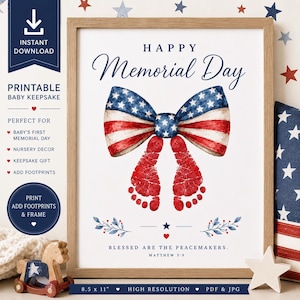 May include: A framed print with a patriotic theme for Memorial Day. The artwork features a bow in the colors of the American flag, with two red footprints below. Text includes "Happy Memorial Day" and "Blessed are the peacemakers."