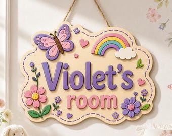 May include: A light-coloured wooden wall sign with a scalloped edge, featuring the purple text "Violet's room". The sign is decorated with a pink butterfly, a colourful rainbow, a white cloud, and pink and purple flowers, all suspended by a rope.