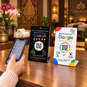Könnte beinhalten: Zwei rechteckige Acrylschilder für Google-Bewertungen. Das schwarze Schild zeigt einen QR-Code, fünf gelbe Sterne und deutschen Text. Das weiße Schild zeigt einen QR-Code, fünf gelbe Sterne und deutschen Text. Beide Schilder haben NFC-Symbole.