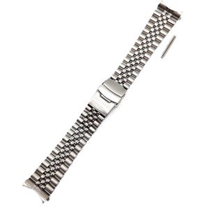 May include: A stainless steel watch band with a polished finish. The band features a series of small, rectangular links connected to form a flexible strap. A folding clasp secures the band, and a small pin is included for attachment. The band is designed to be durable and stylish.
