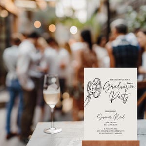 May include: A white graduation party invitation with a black and white illustration of a film reel. The text reads "Please join us for a Graduation Party", "Celebrating Spencer Reid", "Class of 20XX", "BAU University", "15 January, 2025", "At 3 o'clock in the afternoon", "123 Anywhere St., Any City".