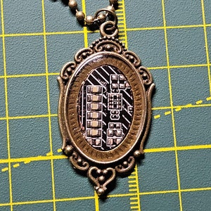 Handmade circuit board necklace made from real recycled circuit board.