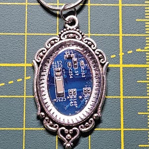 Handmade circuit board necklace made from real recycled circuit board.