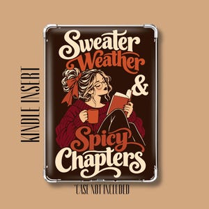 May include: A rectangular Kindle insert featuring a dark brown background with a graphic illustration of a person reading a book while holding a mug. The text reads Sweater Weather & Spicy Chapters in cream and orange script and serif fonts.