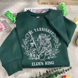Elden Ring Embroidered Sweatshirt, Tarnished Hoodie, Radahn Crewneck, Gaming Apparel for Fans, Perfect Elden Ring Gift, Cozy Gamer Wear.