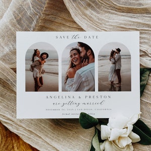 May include: A wedding announcement card featuring three photographs of a couple on a beach. The words "Save the Date" are at the top, with the names "Angelina & Preston" and wedding details below. A white flower and fabric are in the foreground.