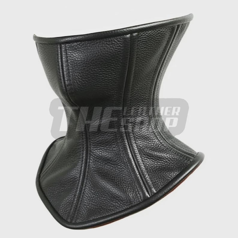 May include: A black leather neck corset with a textured surface. The corset has a curved design and is lined with a contrasting material. The edges are neatly finished with a smooth trim.