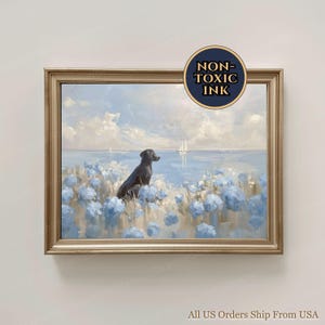 May include: A framed painting depicts a black dog gazing at a sailboat on a serene blue sea. The foreground features blue flowers, and the sky is filled with clouds. The frame is gold, and the artwork is labeled "NON-TOXIC INK".
