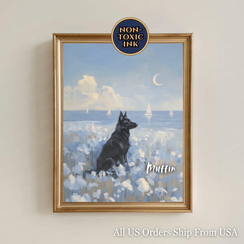 May include: Framed art print featuring a black dog sitting in a field of white flowers, overlooking a seascape with sailboats. The artwork has a gold frame and includes the text "Muffin". The print is labeled "Non-Toxic Ink".