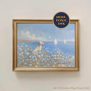 May include: A framed painting depicts a golden retriever gazing at a serene seascape. The artwork features a dog in a field of blue flowers, with sailboats on the water under a cloudy sky. The word "cinnamon" is written on the painting.