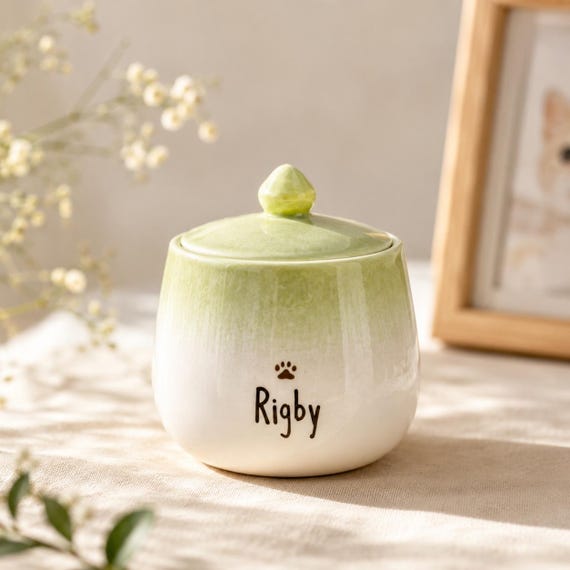 A hand-painted ceramic mini pet urn that's genuinely beautiful rather than clinical — dignified, personalized, and emotionally resonant.
