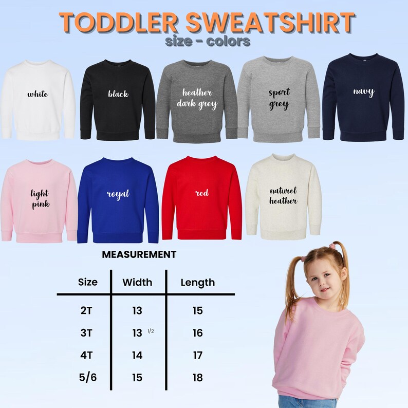 Op de afbeelding: Een selectie van peuter sweatshirts in verschillende kleuren, waaronder wit, zwart, marineblauw en rood. De afbeelding toont ook een maattabel met afmetingen in centimeters, en de tekst "TODDLER SWEATSHIRT".