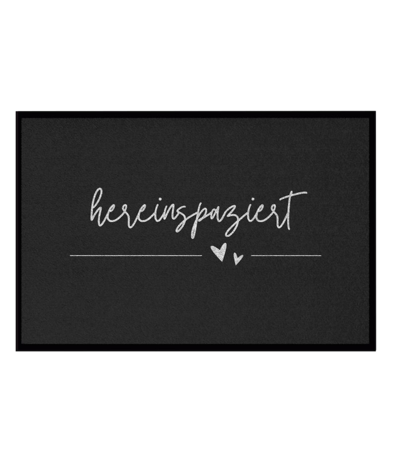 May include: Black doormat with white text that says "herein spaziert" with two small white hearts.