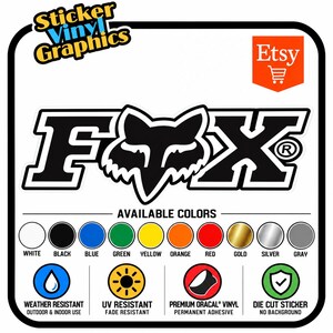 May include: A die-cut vinyl sticker featuring the Fox logo in black and white. The graphic includes text reading Sticker Vinyl Graphics and Etsy. A color chart displays white, black, blue, green, yellow, orange, red, gold, silver, and gray options.