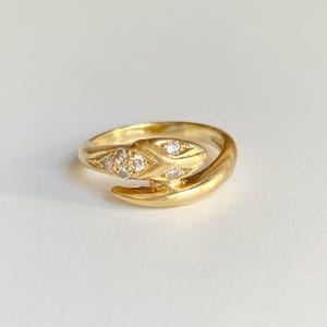 18K yellow gold snake-shaped ring with diamonds