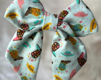 Light turquoise cowgirl Boot Fabric Hair Bow, Western Chic Style Barrette, 5 inch sailor bow with tails, cowboy party, rodeo wear, girl bow