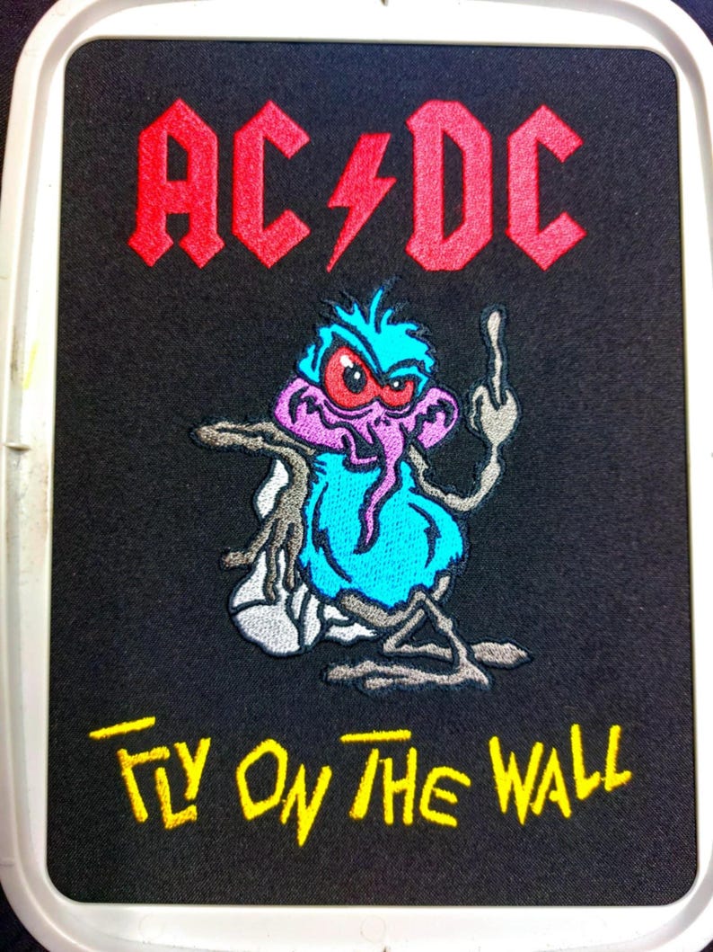 Fly From the Cover of the Music Rock Bands AC/DC Album Machine ...