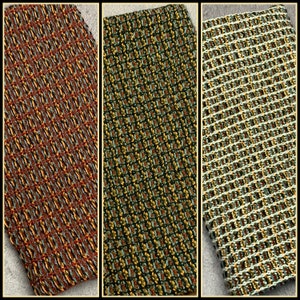 May include: Three woven kitchen towels with a geometric pattern. The towels are in shades of red, green, and white.