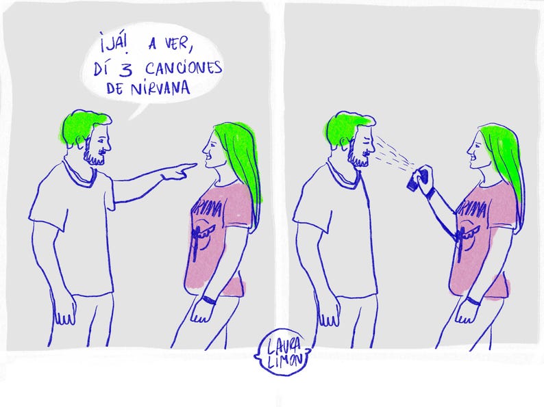 May include: A two-panel comic strip in blue and white. The first panel shows a man pointing at a woman, with text above. The second panel shows the woman spraying the man with a spray bottle. The woman wears a pink shirt with a Nirvana graphic.