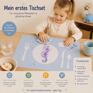 May include: A light blue rectangular placemat featuring a white seahorse illustration in the center, surrounded by white outlines of a fork, knife, spoon, and a small scuba diver. The mat includes German text and icons detailing product features.