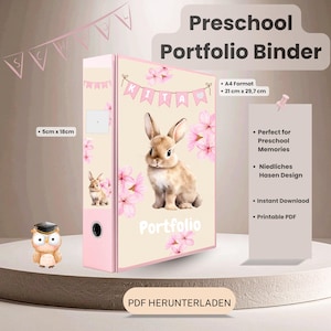 May include: A cream-colored preschool portfolio binder featuring a brown bunny illustration, pink cherry blossoms, and a banner with the text KITA. The binder includes a spine label area, measures 21 cm by 29.7 cm, and has a 5 cm by 18 cm spine.