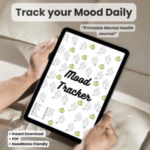 Könnte beinhalten: Ein digitaler Stimmungstracker, der auf einem Tablet angezeigt wird. Der Bildschirm zeigt ein Kalenderlayout mit Kaktusillustrationen und den Worten "Mood Tracker". Der Text oben lautet "Track your Mood Daily" und "Printable Mental Health Journal."