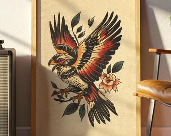 May include: A framed print featuring a traditional tattoo-style illustration of a hawk with outstretched wings. The hawk is depicted in shades of red, orange, and black, with a floral accent and dark green leaves. The artwork is set against a tan background.