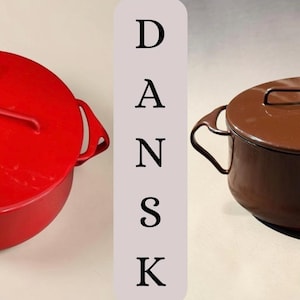 May include: Two round enameled metal pots with lids, one bright red and one dark brown. Each lid features a distinctive cross-shaped handle that doubles as a trivet. The word DANSK is printed vertically in black letters on a light gray background.