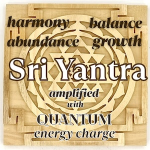 May include: A wooden Sri Yantra with a geometric design, surrounded by the words "harmony", "abundance", "balance", and "growth". The text "amplified with QUANTUM energy charge" is also included.