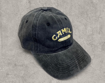 Vintage style baseball cap in black with yellow camel logo.