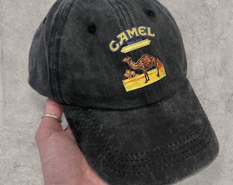 Vintage style baseball cap in black with yellow camel logo.
