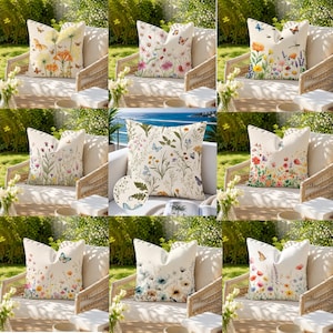 May include: A collection of nine square throw pillows featuring various botanical and insect illustrations on off-white fabric. Each pillow displays colorful wildflowers, butterflies, and dragonflies in detailed prints, arranged on outdoor wicker chairs.
