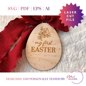 May include: Wooden Easter egg ornament with the text "my first EASTER" and floral design. The ornament is suspended from a red ribbon. The words "SVG | PDF | EPS | AI" and "LASER CUT FILE" are also visible.