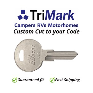 May include: A silver-colored key with the text "ILCO USA" stamped on the head. The key is designed for campers, RVs, and motorhomes. The image includes the TriMark logo and the text "Custom Cut to your Code".