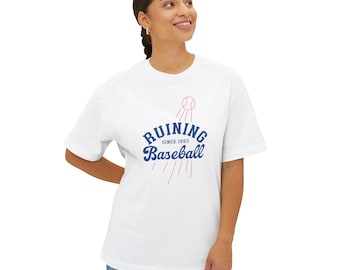May include: White t-shirt with the text "RUINING Baseball SINCE 1883" in blue and red. The design includes a baseball and lines suggesting motion. The shirt is a casual, unisex style.