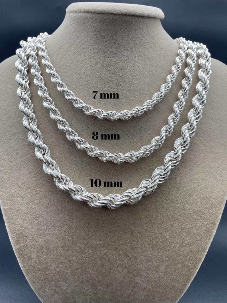 May include: Three silver rope chains of different thicknesses, 7mm, 8mm, and 10mm, displayed on a mannequin.